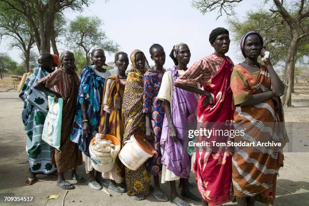 Scene during an International Committee of the Red Cross distribution of seeds, agricultural tools and food staples to households in villages around...