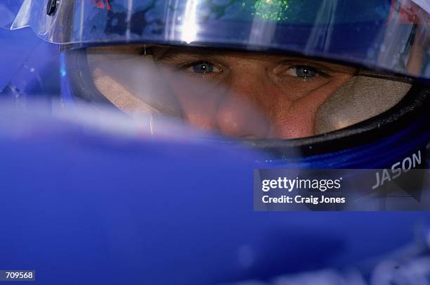 Close up of Jason Bright as he looks on from his car during the Michigan 500, part of the Indy Racing Northern Lights Series at the Michigan Speedway...