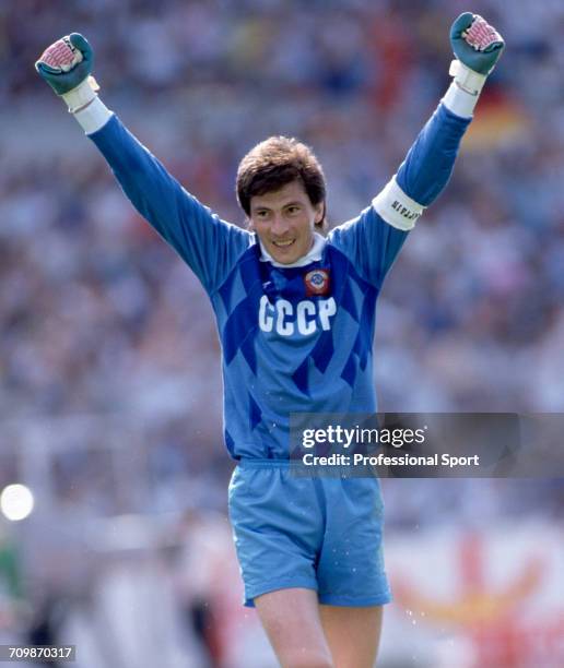 Russian goalkeeper and captain Rinat Dasayev raises both arms in the air during play for the Soviet Union team in the UEFA Euro 1988 European...