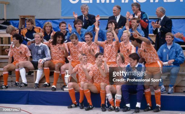The Netherlands football team celebrate with the UEFA European Championship trophy after Netherlands beat the Soviet Union 2-0 to become champions in...