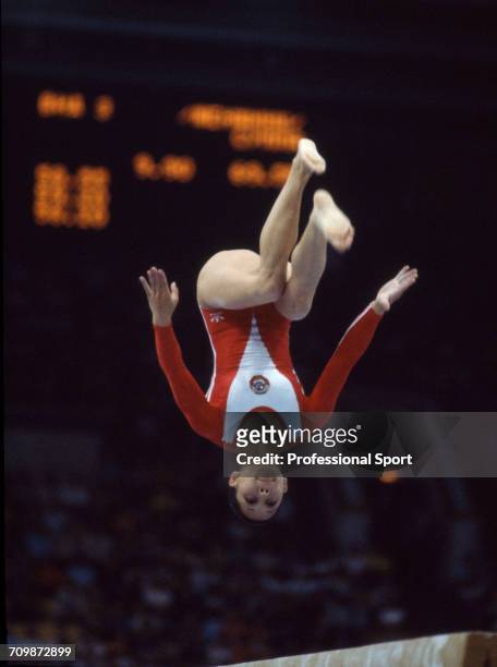 Soviet gymnast Nellie Kim pictured in action for the Soviet Union team on the balance beam during competition in the women's artistic team all-around...