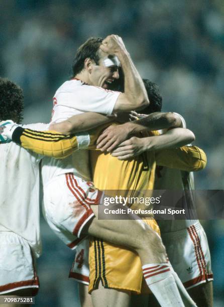 Russian footballer Vagiz Khidiyatullin is lifted up by goalkeeper Rinat Dasayev during celebrations by the Soviet Union team in the UEFA Euro 1988...