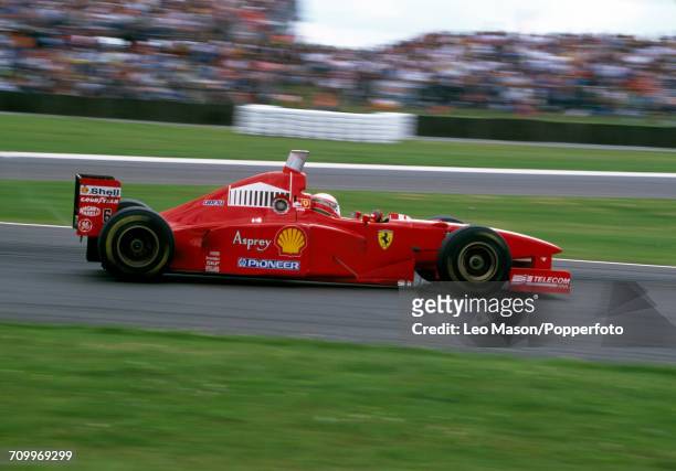 Eddie Irvine of Great Britain, driving a Ferrari F310B with a Ferrari 046/2 V10 engine for Scuderia Ferrari Marlboro, in action during the British...