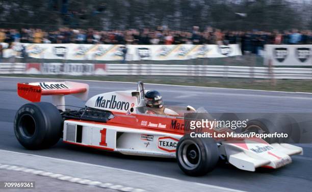 James Hunt of Great Britain, driving a McLaren M23 with a Ford Cosworth V8 engine for Marlboro Team McLaren, enroute to winning the Race of Champions...