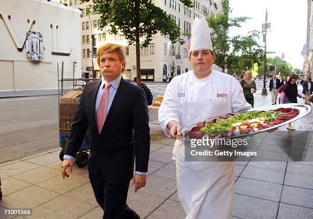 John, a Donald Trump impersonator, and Embassy Suites Battery Park Hotel Chef Scott Gorman pose with "The Domelet" outside Trump Tower on May 21,...