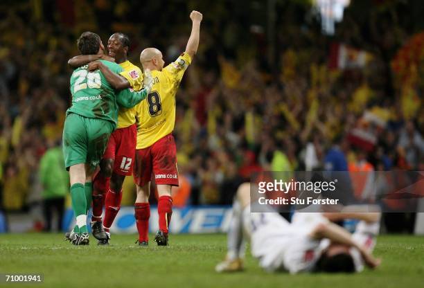 Ben Foster, Lloyd Doyley and Gavin Mahon of Watford celebrate as the final whistle blows, whilst Jonathan Douglas of Leeds lays dejected on the pitch...