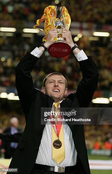 Watford Manager Adrian Boothroyd lifts the Trophy following his Team's victory during the Coca-Cola Championship Playoff Final between Leeds United...