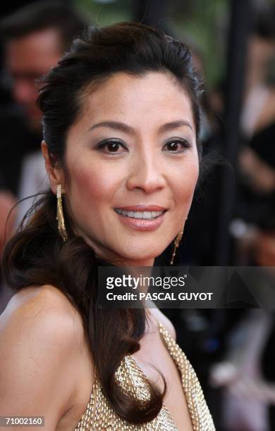 Malaysian actress Michelle Yeoh poses upon arriving at the Festival Palace for the premiere of US directors Tim Johnson and Karey Kirkpatrick's...