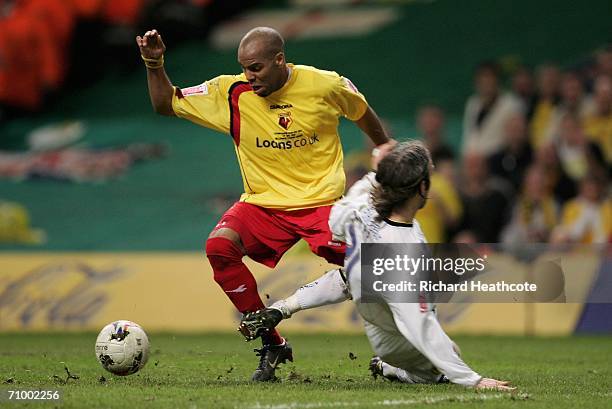 Marlon King of Watford is brought in the penalty box by Shaun Derry of Leeds to win his side a penalty, which later resulted in his team's third goal...