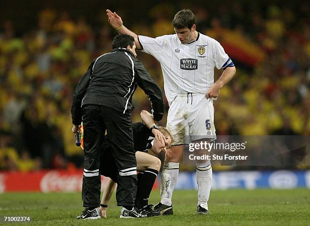 Paul Butler the Leeds Captain gestures for injured Linesman Gavin Ward to leave the pitch and let play continue during the Coca-Cola Championship...