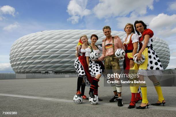Models present traditional Bavarian clothes in football style at the Allianz Arena on May 21, 2006 in Munich, Germany. The collection has been...
