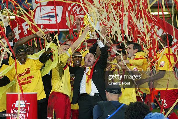 Watford Manager Adrian Boothroyd and his players celebrate with the trophy following their victory during the Coca-Cola Championship Playoff Final...