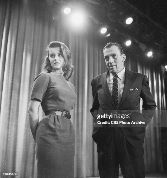Swedish-born actress Ann-Margret and American television personality Ed Sullivan glace offstage during an appearance on the television variety...