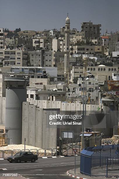 General view of the Israeli separation barrier surrounding Ramallah is seen on May 22, 2006 from the Qalandia check point in the West Bank. Israel...