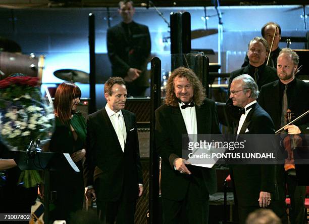 Swedish King Carl XVI Gustaf poses for a picture with members of British rock band Led Zeppelin John Paul Jones and Robert Plant , and Zoe Bonham ,...