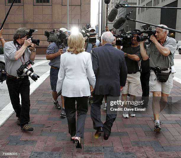 Former Enron chairman Kenneth Lay and his wife Linda face news cameras as they leave the the Bob Casey U.S. Courthouse for the midday break in his...