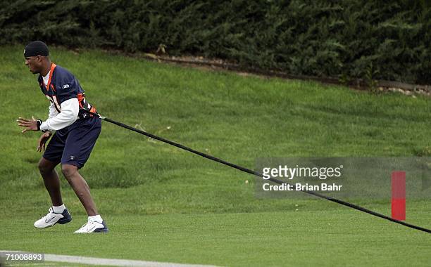 Wide receiver Javon Walker of the Denver Broncos pulls on a bungee cord during spring minicamp May 22, 2006 at the Paul D. Bowlen Memorial Broncos...
