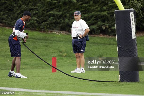 Wide receiver Javon Walker of the Denver Broncos pulls on a bungee cord during spring minicamp May 22, 2006 at the Paul D. Bowlen Memorial Broncos...