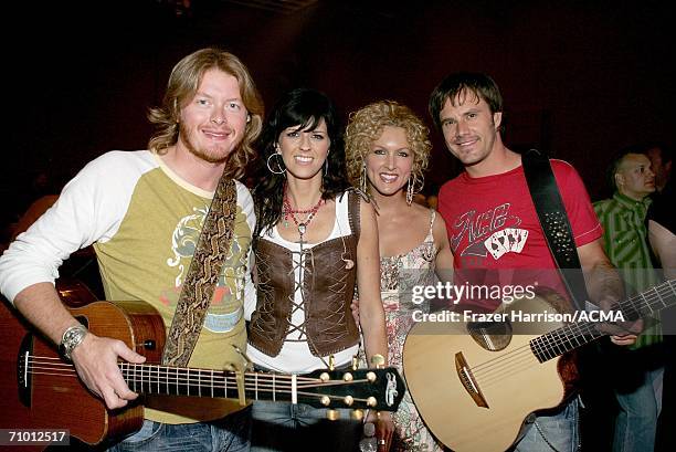 Musician Phillip Sweet, Karen Fairchild, Kimberly Roads and Jimi Westbrook of Little Big Town pose backstage during the Academy Of Country Music New...