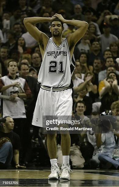 Tim Duncan of the San Antonio Spurs walks on the court dejected during overtime against the Dallas Mavericks in Game Seven of the Western Conference...