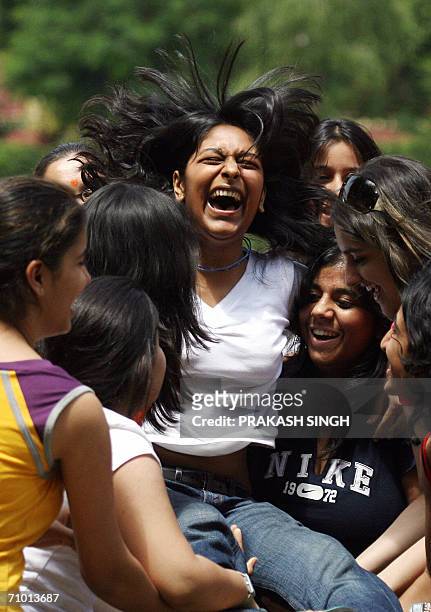 Class XII students of the Convent of Jesus and Mary jubliate after getting their examination results in New Delhi, 23 May 2006. Central Board of...