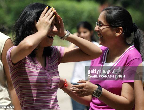 Class XII students of the Convent of Jesus and Mary jubliate after getting their examination results in New Delhi, 23 May 2006. Central Board of...