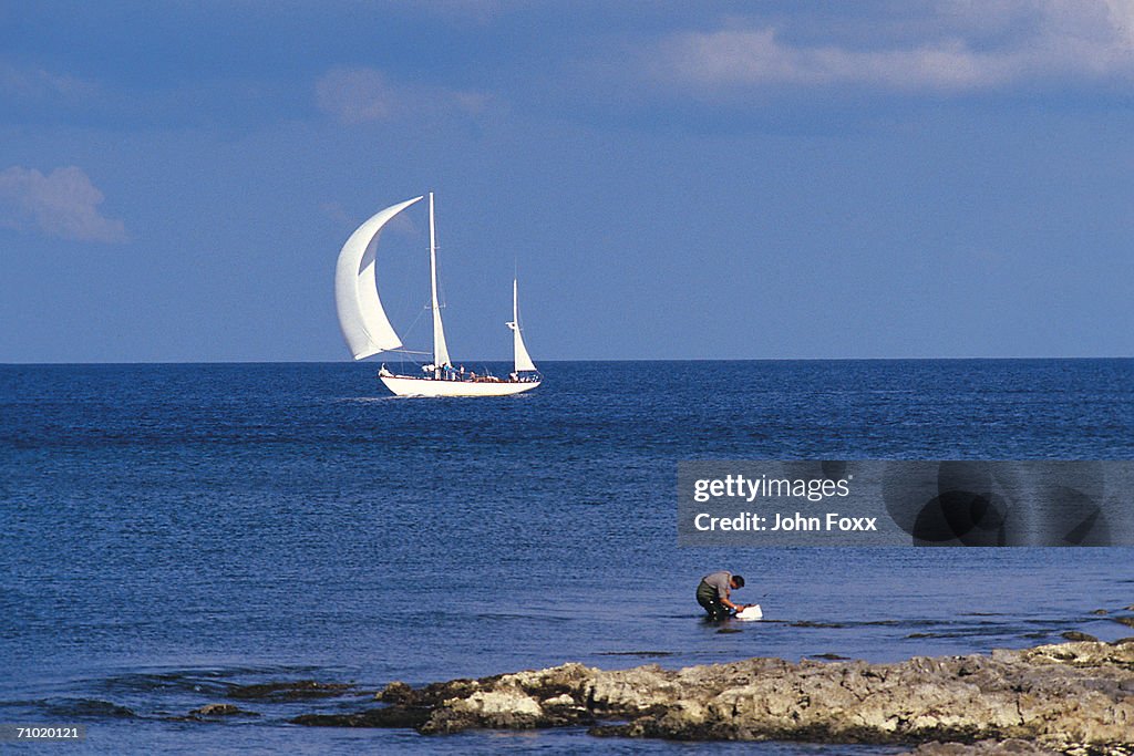 Sailing boat at open sea