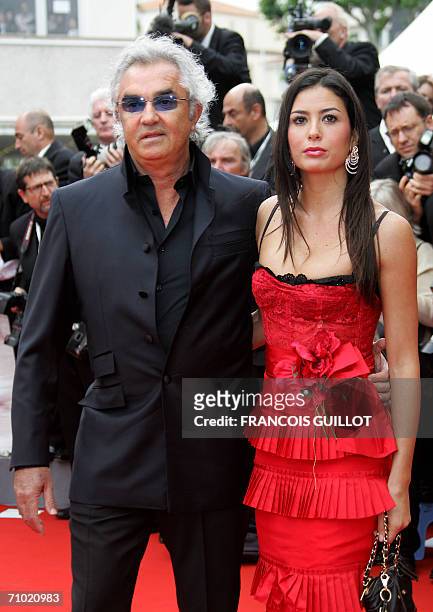 Managing Director of Renault F1 Flavio Briatore and Elisabetta Gregoraci pose upon arriving at the Festival Palace for the premiere of Mexican...