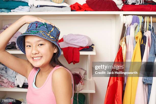 portrait of a girl wearing a hat - closet one girl only stock pictures, royalty-free photos & images