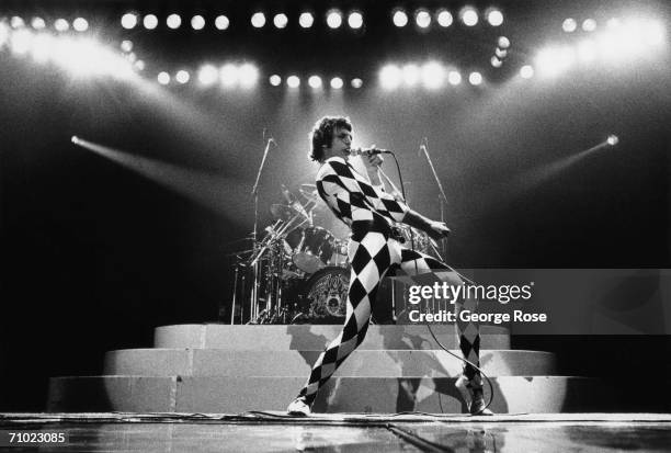 Singer Freddie Mercury, of the rock group Queen, prances onstage during a 1978 concert at the Great Western Forum in Inglewood, California.