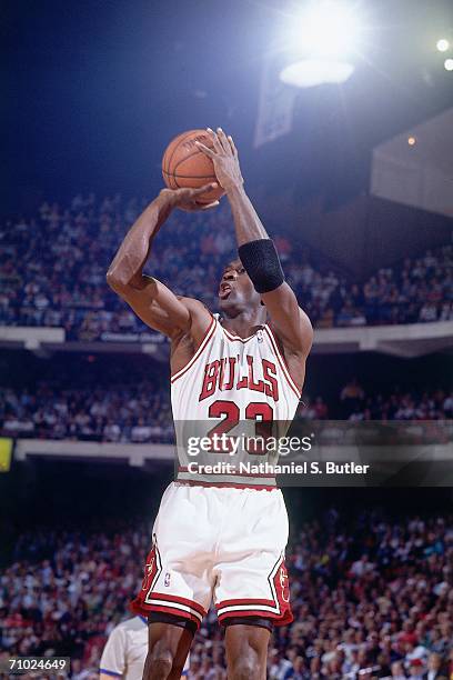 Michael Jordan of the Chicago Bulls shoots a jump shot against the Cleveland Cavaliers during Game One of the Eastern Conference Finals during the...