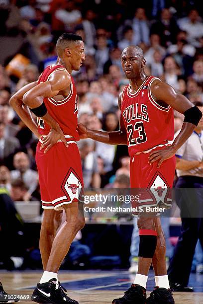 Michael Jordan talks with teammate Scottie Pippen of the Chicago Bulls during Game Three of the Eastern Conference Finals against the Cleveland...