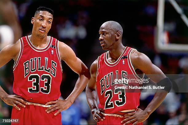 Michael Jordan of the Chicago Bulls talks with teammate Scottie Pippen during a game against the Philadelphia 76ers in 1992 at the Spectrum in...