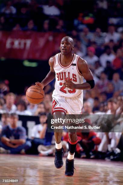 Michael Jordan of the Chicago Bulls drives the ball up court against the Portland Trail blazers during game six of the NBA Finals played on June 14,...