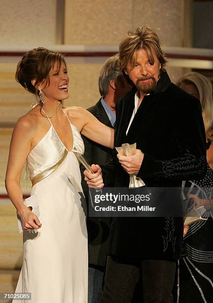 Ronnie Dunn of the band Brooks & Dunn accepts the award for Song of the Year from television personality Hannah Storm onstage during the 41st Annual...