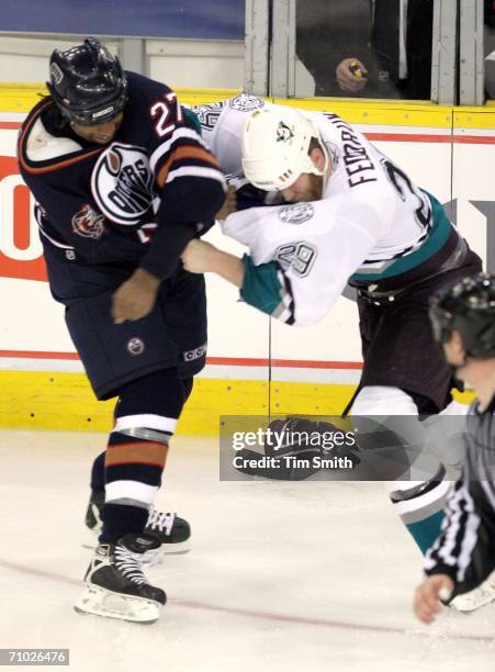 Georges Laraque of the Edmonton Oilers exchanges blows with Todd Fedoruk of the Mighty Ducks of Anaheim in the third period in game three of the...