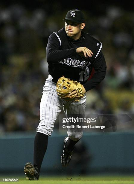 Clint Barmes of the Colorado Rockies throws to first base and retires Oscar Robles of the Los Angeles Dodgers during the game on May 23, 2006 at...