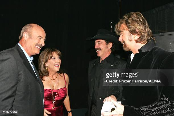 Television host Dr. Phil McGraw, wife Robin and Kix Brooks and Ronnie Dunn of Brooks & Dunn talk backstage during the 41st Annual Academy Of Country...
