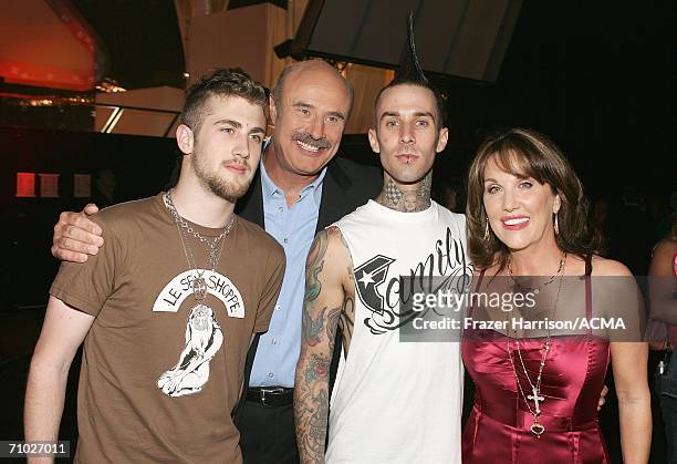 Television host Dr. Phil McGraw, wife Robin, their son Jordan McGraw pose with drummer Travis Barker, backstage during the 41st Annual Academy Of...