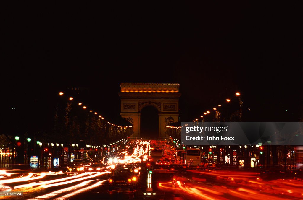France, Paris, Arc de Triomphe, Traffic on street at night (long exposure)