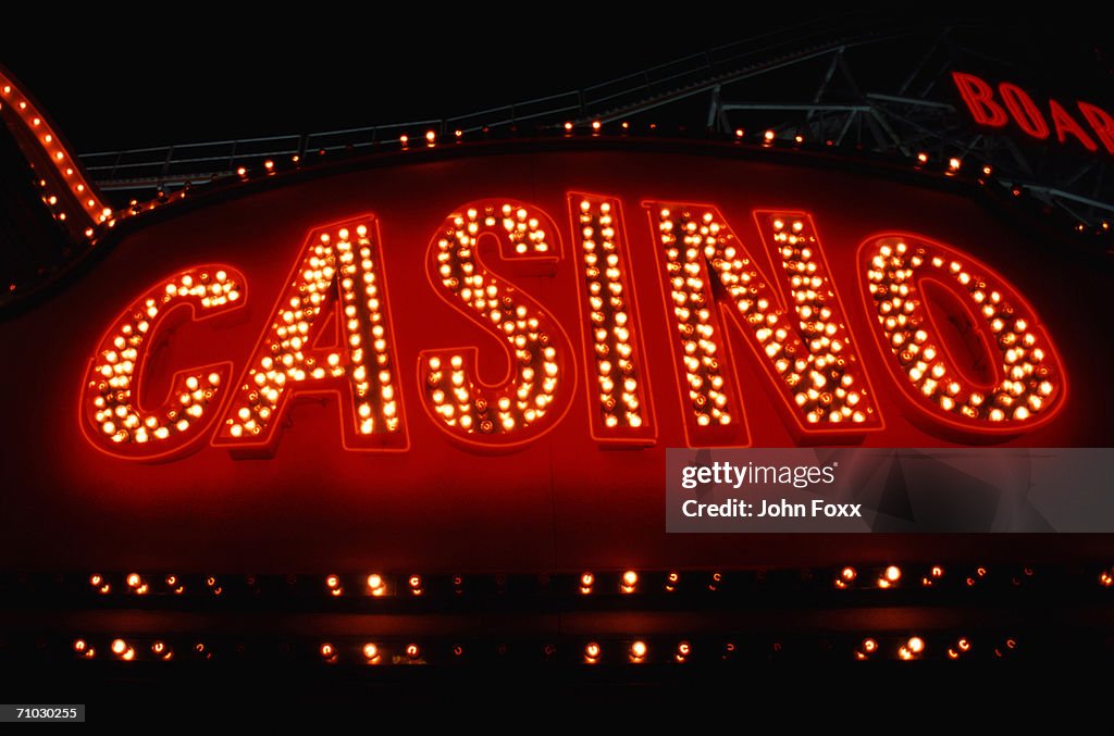 Casino neon sign illuminated at night, close-up