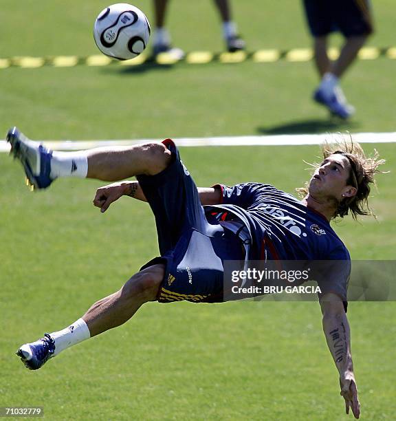 Spanish defender Sergio Ramos goes for an overhead kick during a training session at the Las Rozas sporting complex outside Madrid, 24 May 2006....