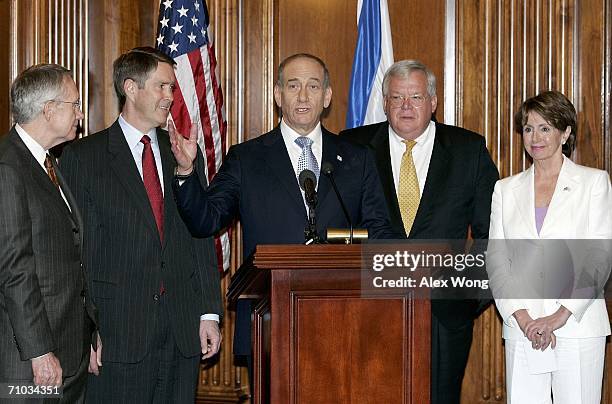Israeli Prime Minister Ehud Olmert makes remarks as U.S. Senate Minority Leader Harry Reid , Senate Majority Leader Bill Frist , Speaker of the House...