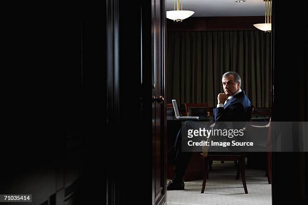 portrait of a ceo in his office - physical stance stock pictures, royalty-free photos & images