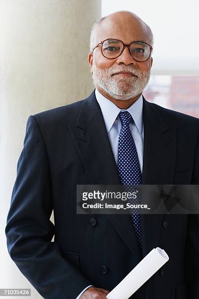 portrait of a mature businessman - black suit stock pictures, royalty-free photos & images