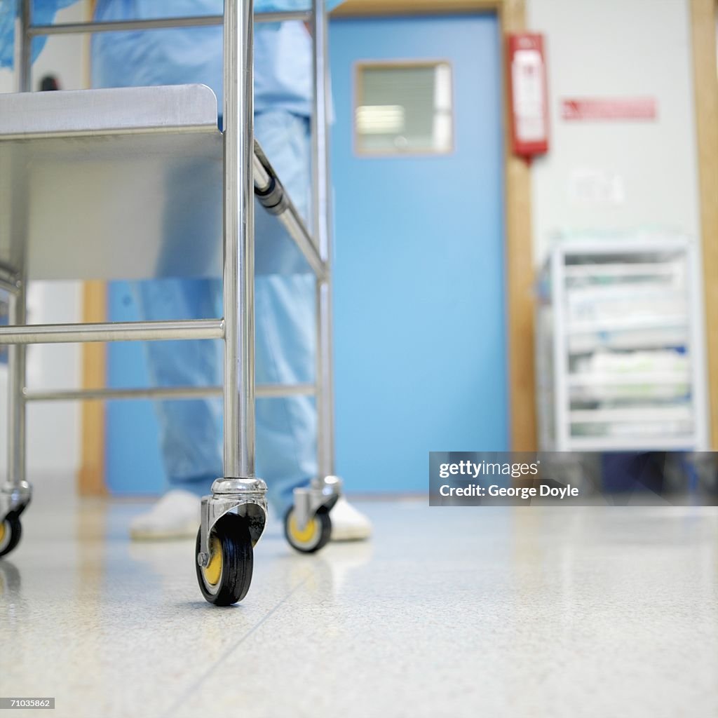 Low angle view of a woman pushing a trolley in a hospital