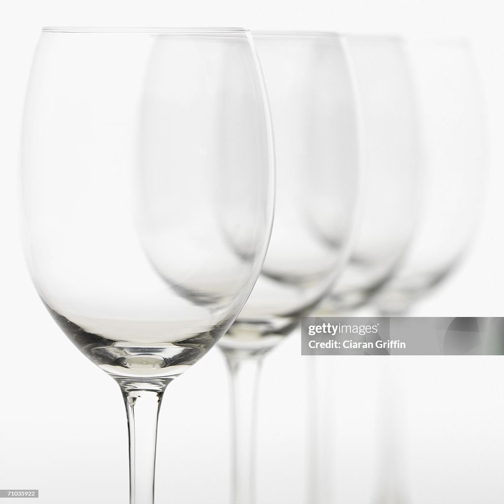 Close-up of empty wineglasses in a row