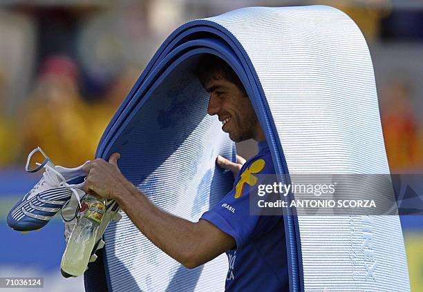 Brazilian football player Juninho Pernambucano carries carpets after the Brazil's first training session, 24 May 2006, in Weggis. Brazil's World Cup...