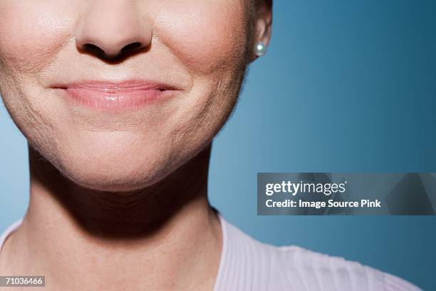 woman smiling - mouth smirk stock pictures, royalty-free photos & images
