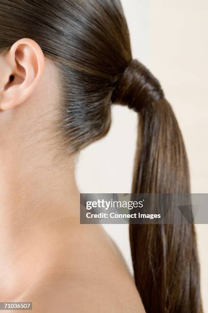 woman with ponytail - ponytail hairstyle stock pictures, royalty-free photos & images